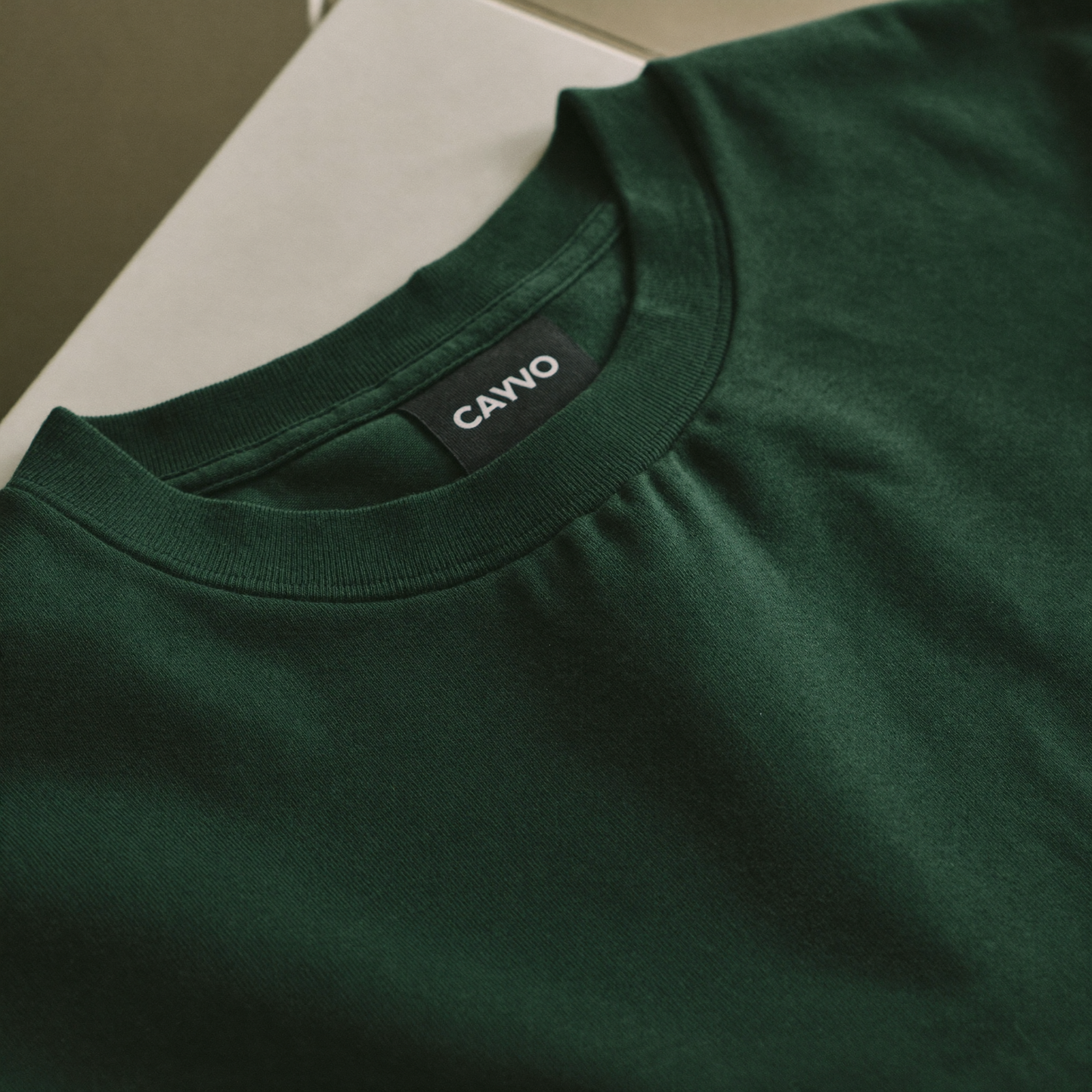Close-up fabric texture and neckline detail of The Basic T